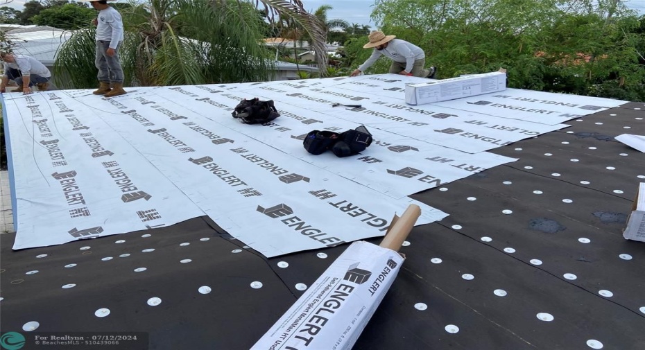 New roof underlayment brown paper, black paper and white peel and stick rubber under the Metal