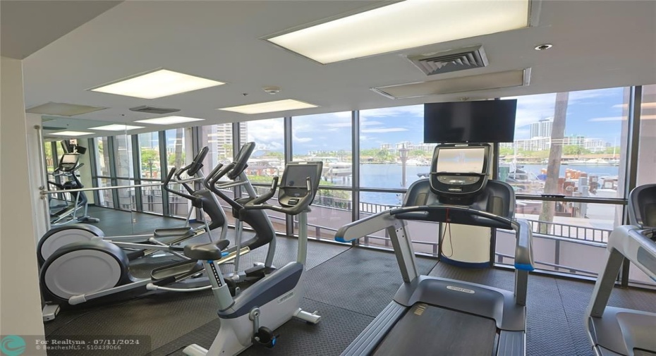 a workout room with a view