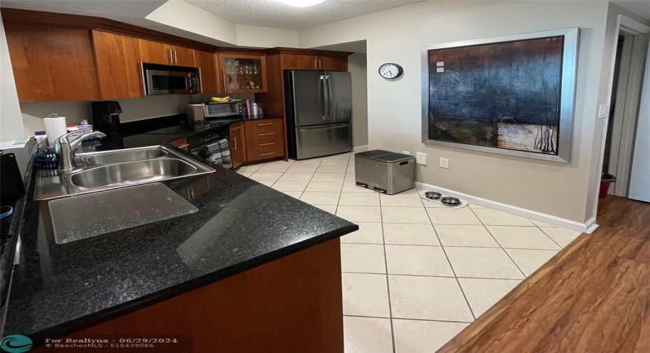 Granite counters, stainless appliances.  Room for a breakfast table.
