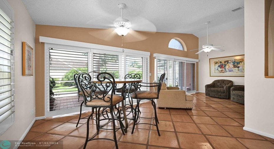 The Florida/Family room extends across with endless possibilities.  Currently used as a game room.