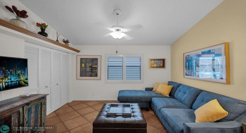 3rd bedroom currently used as a den has double pocket door entrance & large double closet with lovely built-in shelf above.