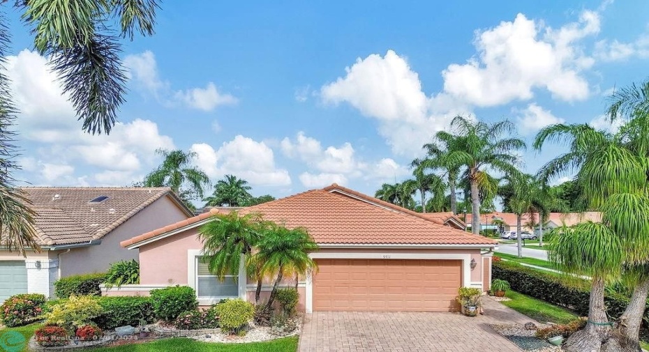 Front of your beautiful home with paver drive & lush landscaping.