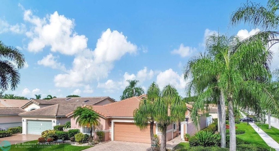 Corner lot is generously set back from the street with privacy landscaping.