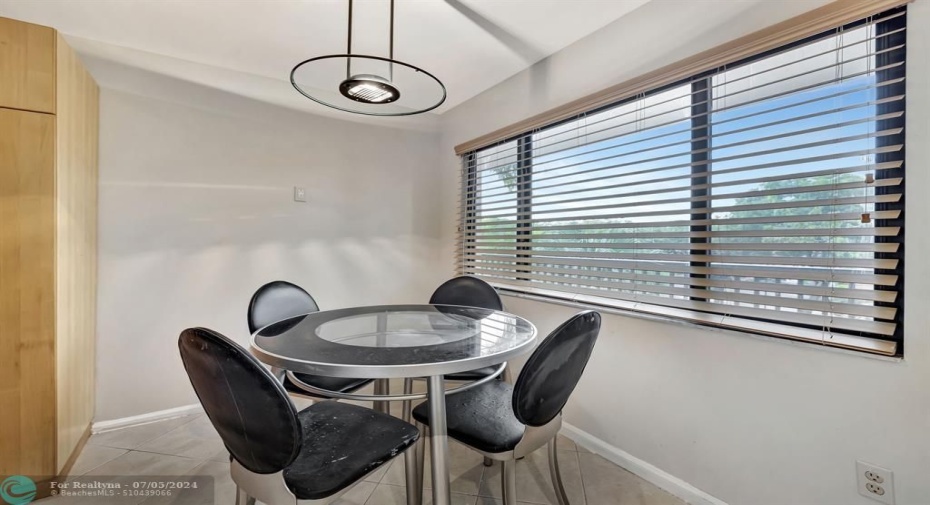 Eat in kitchen, wood blinds on impact windows