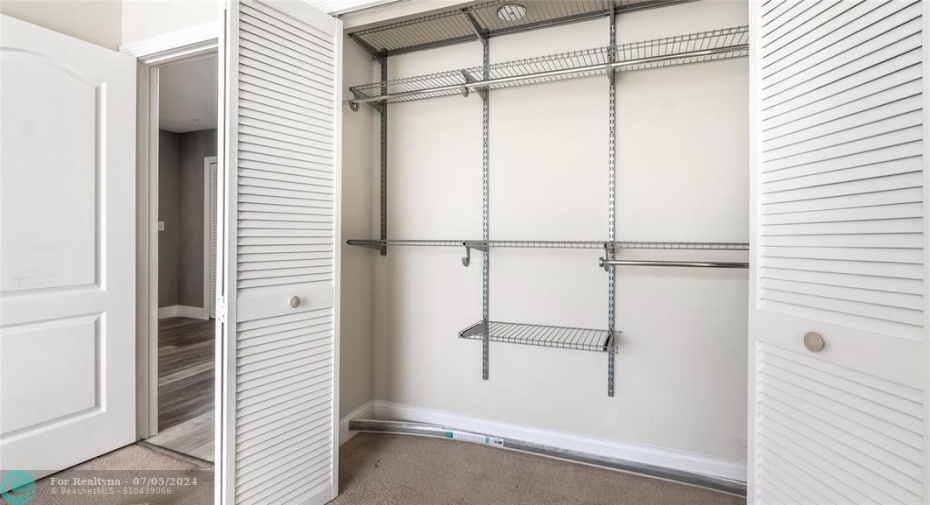 2nd bedroom closet with organizers