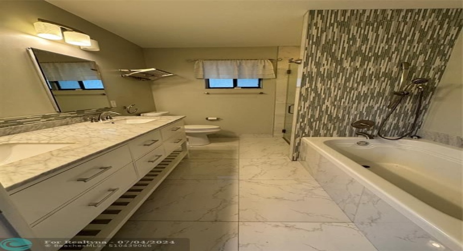 Master Bathroom Tub area with dual sinks