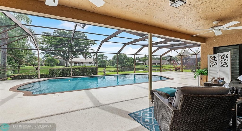 large screened lanai with water and pool views