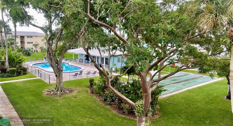 View from Balcony to Pool & Green Space