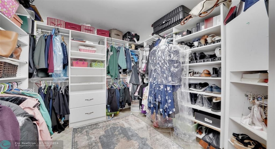 Well-designed built-ins greatly increase the storage space in the master closet