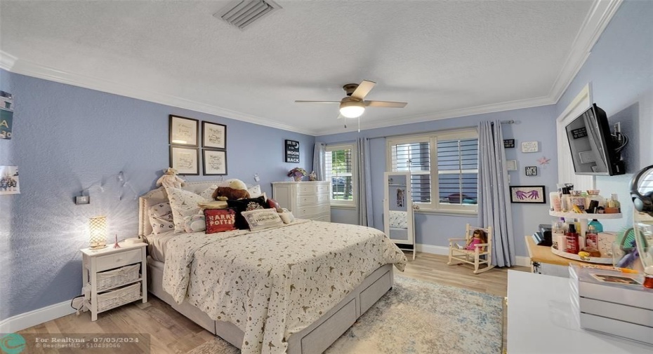 spacious 2nd bedroom, plantation shutters, textured ceilings and walls add to the charm of this home