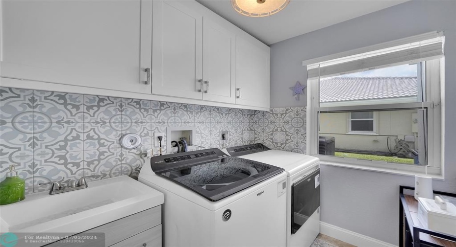 washer and dryer are still under warranty, check out the storage, large sink and backsplash. Great to have a large window to make necessary jobs easier