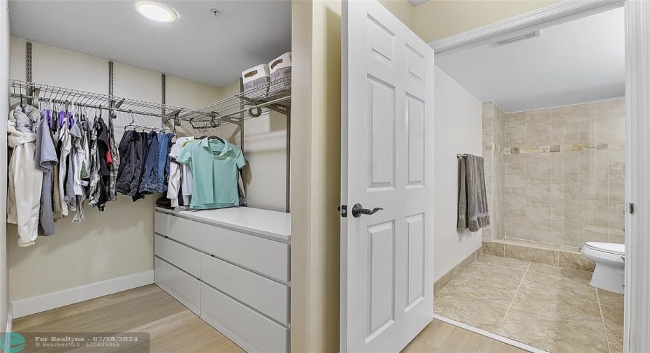 Master bedroom walk-in closet is opposite the make up vanity with lots of space to get ready