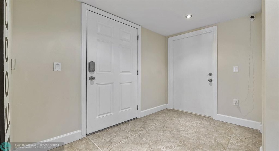 this is the front door to the left and the garage entry door to the right, Only the ground floor units have direct access to the garage, the 2nd and 3rd floor units do not have direct access to their garages,