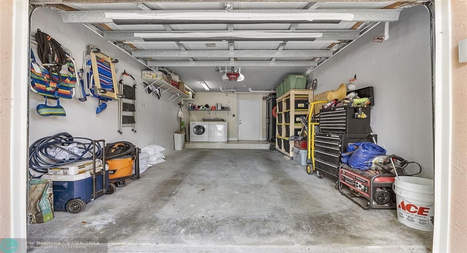 Garage has space on either side for storage and can still fit a large auto inside.