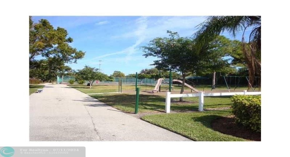 Public park, next to Meadowridge, with jogging area, picnic area with two tennis courts, playground, etc.