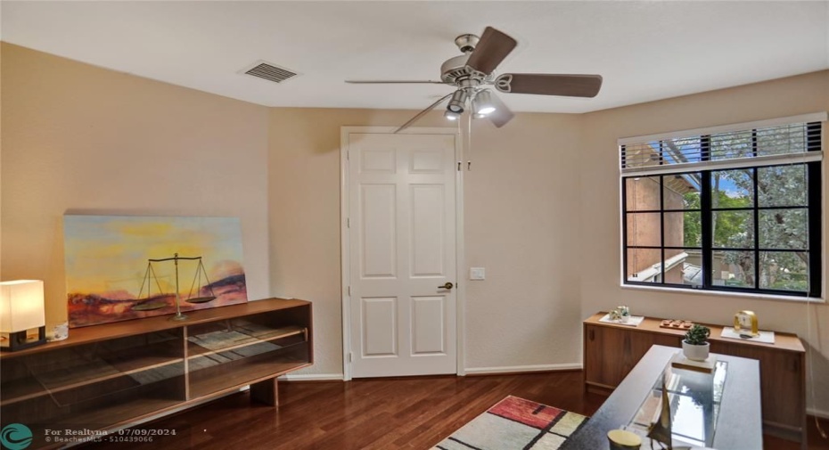3rd Bedroom or Den/Office with closet, ceiling fan and impact glass window.