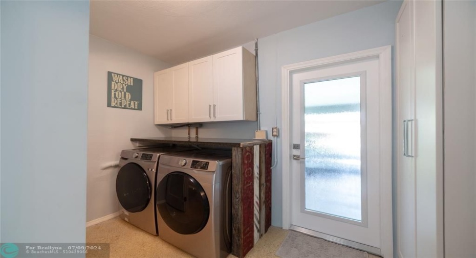 Laundry area with updated newer washer and dryer.