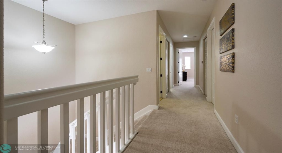 Brightly lighted Second Floor hallway with Incredible SmartStrand Carpet by Mohawk