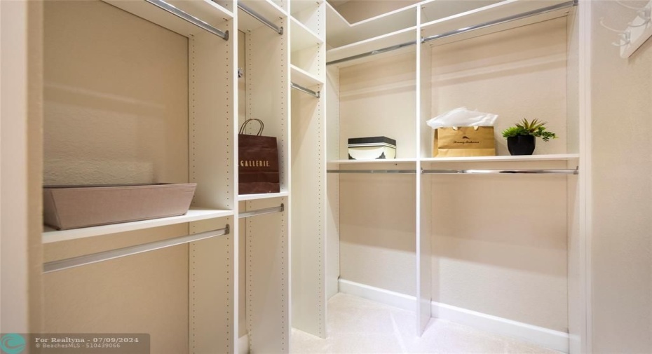 Another Primary Walk-In Closet with Custom Built-Ins is Incredible !!