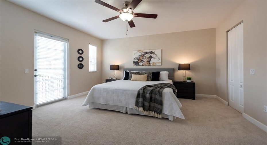 Your Huge, Peaceful Master Bedroom has a Lovely Balcony with Hurricane Impact Doors