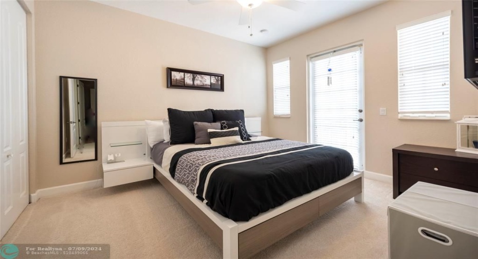 This Beautiful Bedroom Has a Balcony with Impact Door and 2 Impact Windows, Closet has Built-Ins