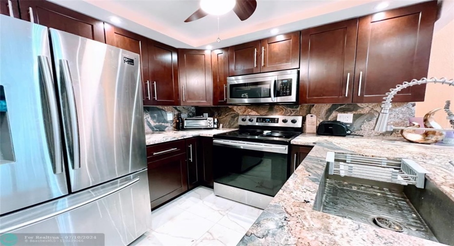 Stainless Steel appliances and Wood cabinets...