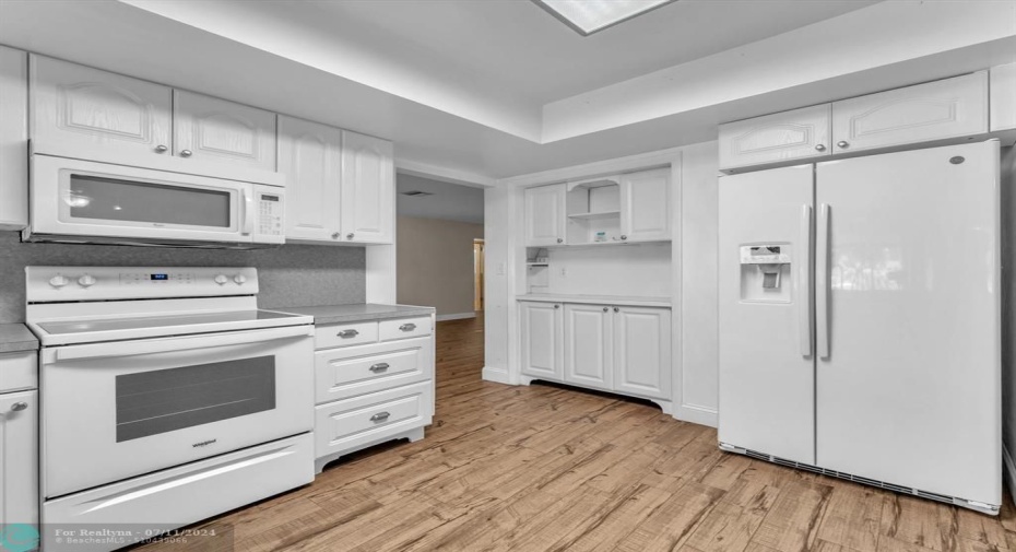 Ample storage space in the bright kitchen cabinets