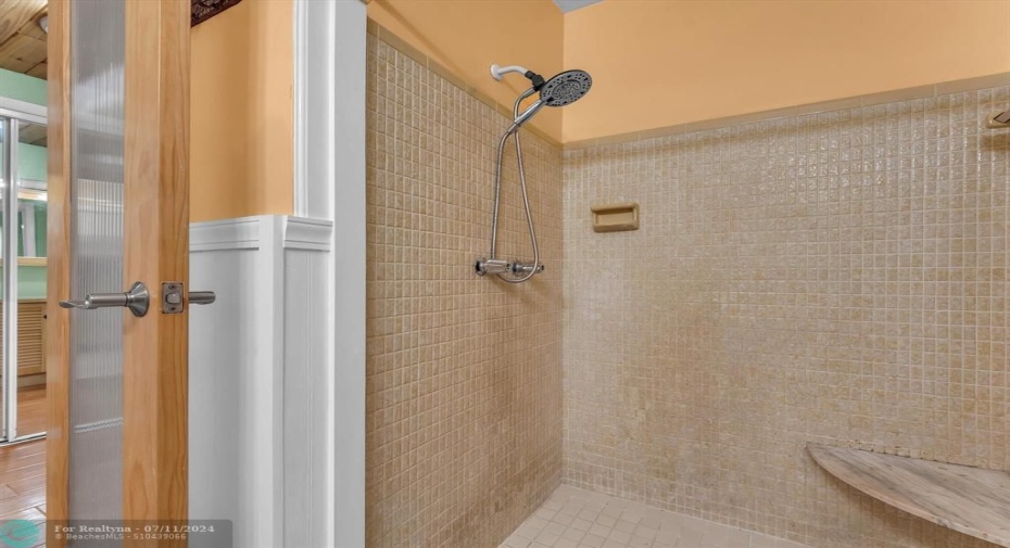 Updated shower with sitting bench makes getting ready easy