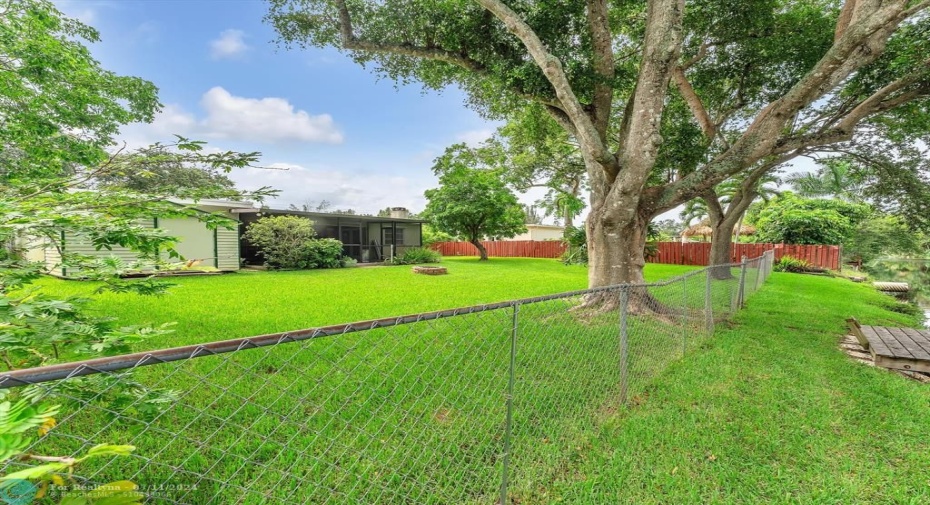 Enjoy playing your favorite sport in the large oversized fenced backyard