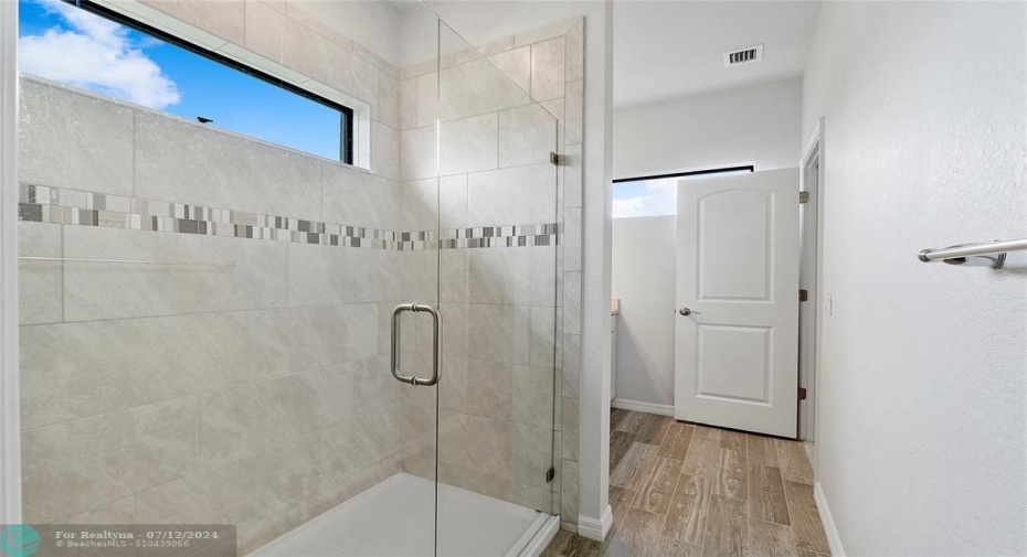 Shower with Frameless Glass door.