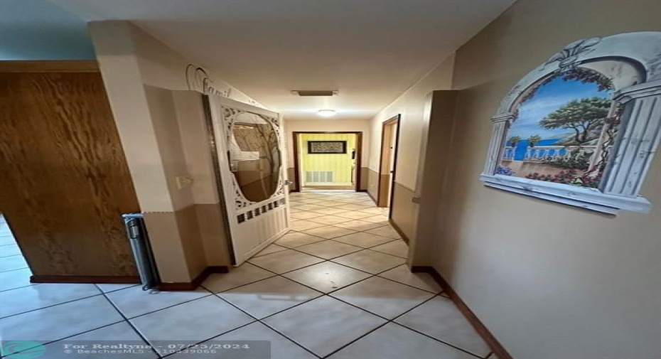 Hall leading into laundry room and Den/Hobby room