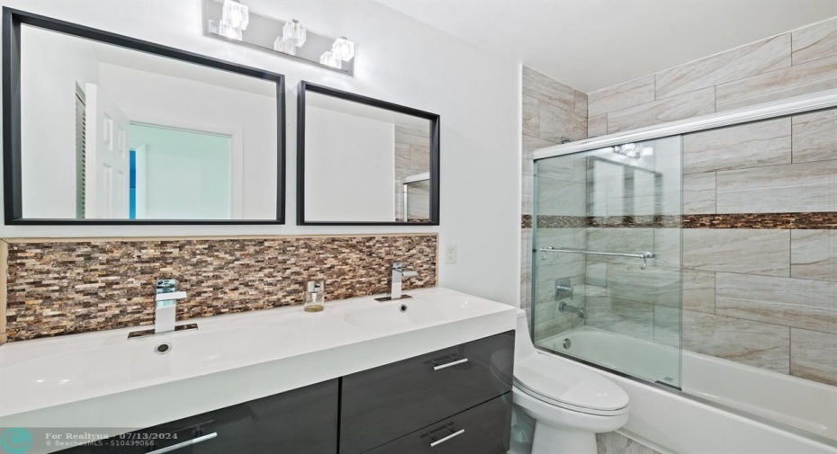 Completely Renovated Guest Bath with Dual Sinks, Shower and Tub