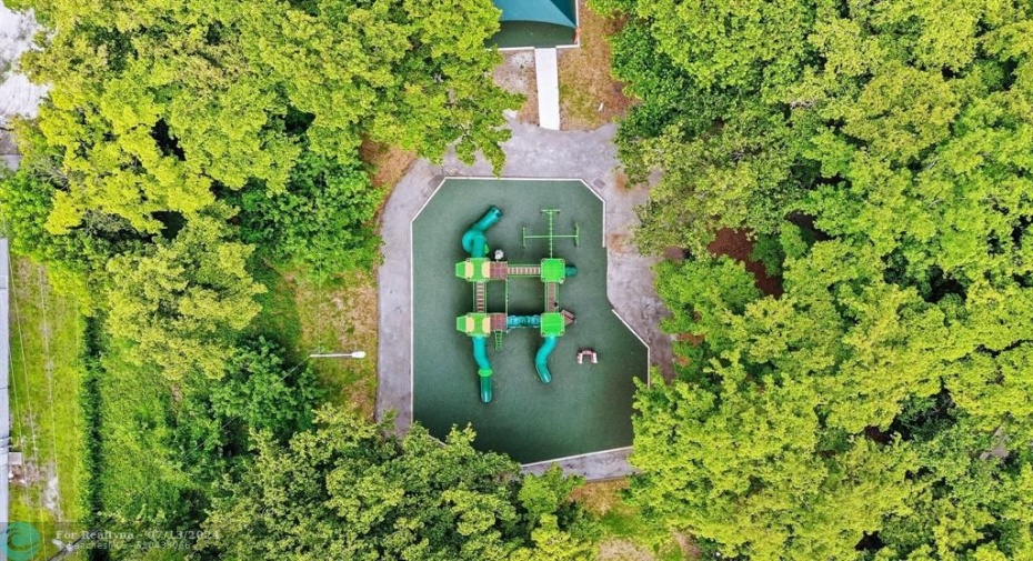 New playground in neighborhood park with dog park and jogging path