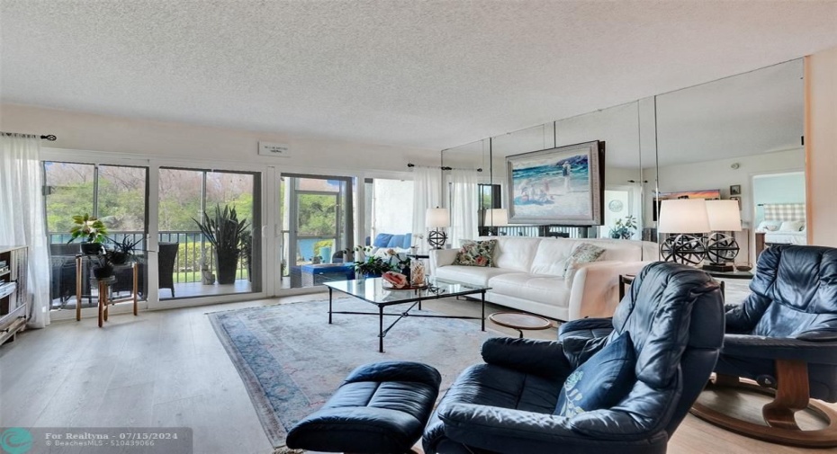 Living room leads out to a large patio and offers amazing water views.  No condos looking at you!