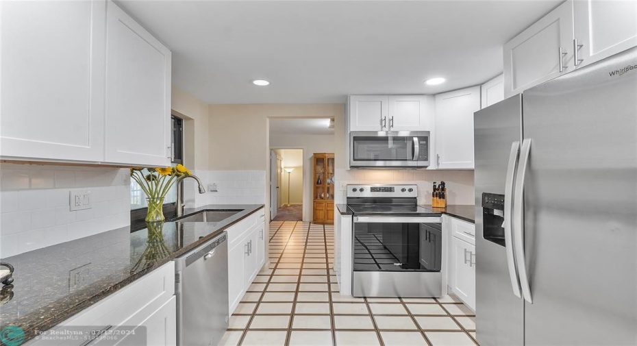 Kitchen view leading to Dining Room and Main Bedroom