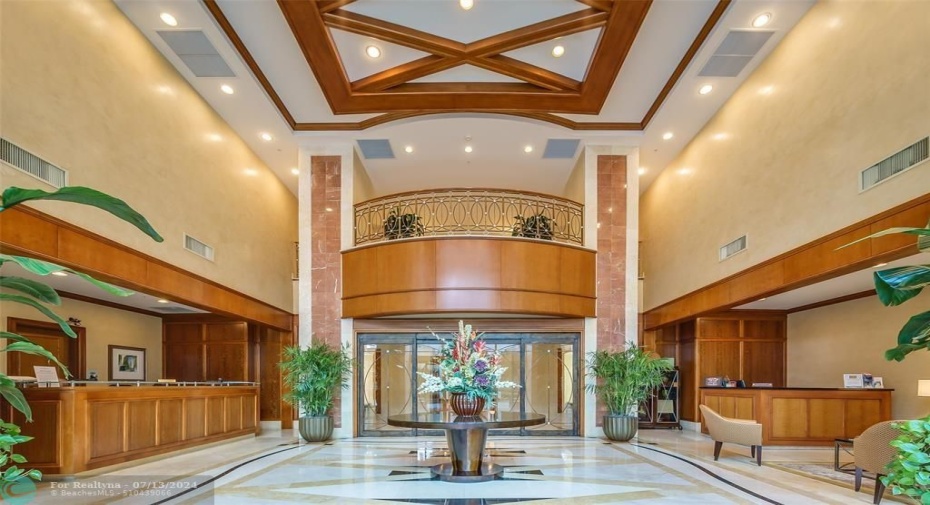 2 story lobby with desk attendant, security & concierge