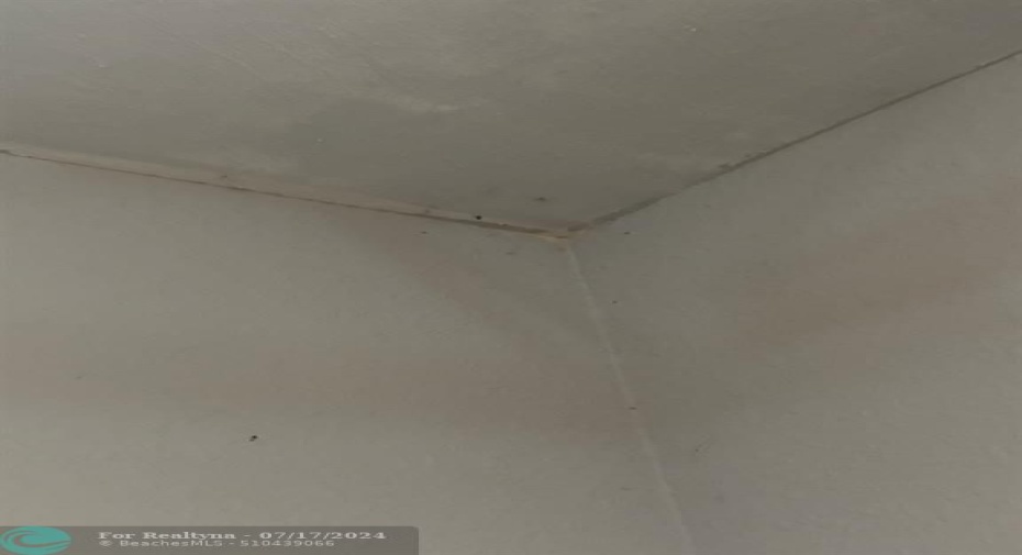 wall & ceiling discolored due to leak