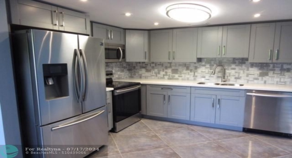 Shaker cabinets, Quartz Countertops Stainless Appliances and updated electric