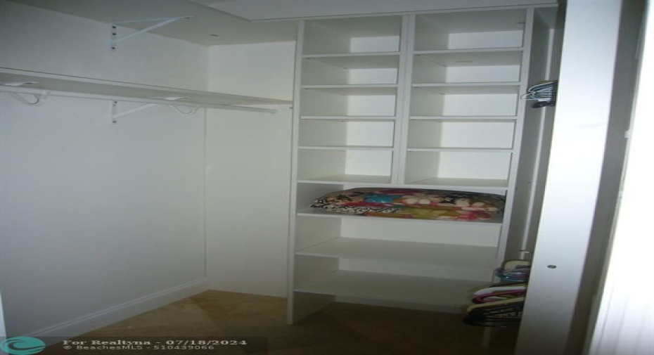 Master closet with shelfing