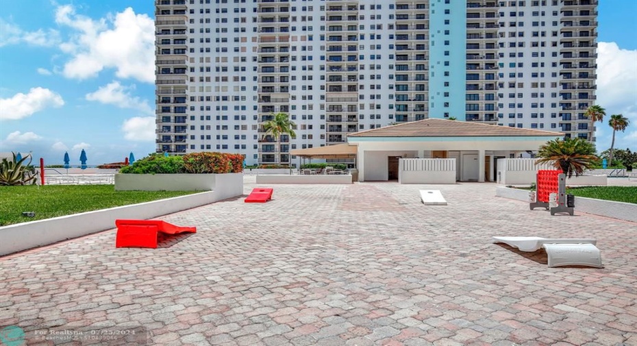 Huge pool deck with room for cornhole and more