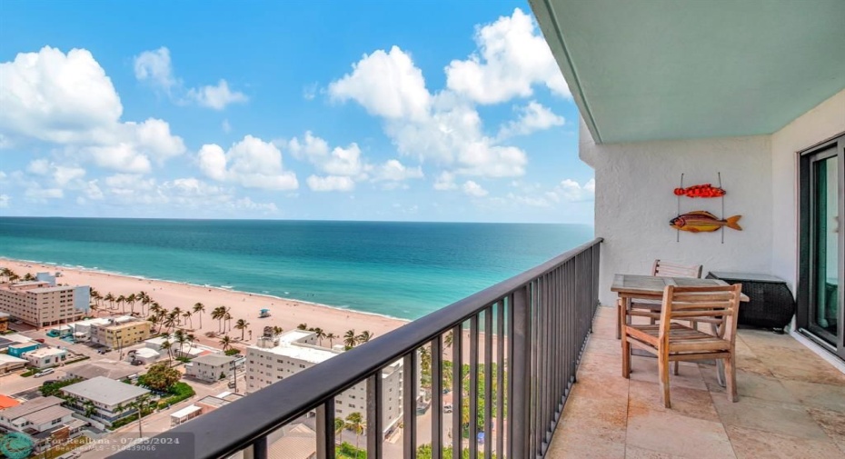 Ocean view from the large balcony that accommodates two separate sitting areas and more!