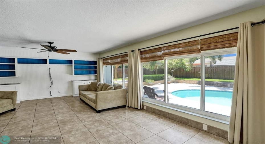 Family/Bonus  Room with Wall of Impact Windows with relaxing Pool Views.