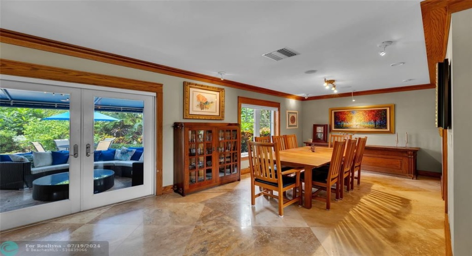 Dining Room overlooking outdoor living room.  Has specialty Art lighting