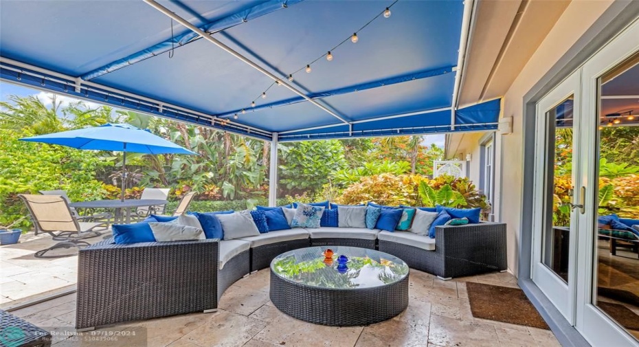 Outdoor Living Screened-in Living Area with a view toward the backyard patio and pool