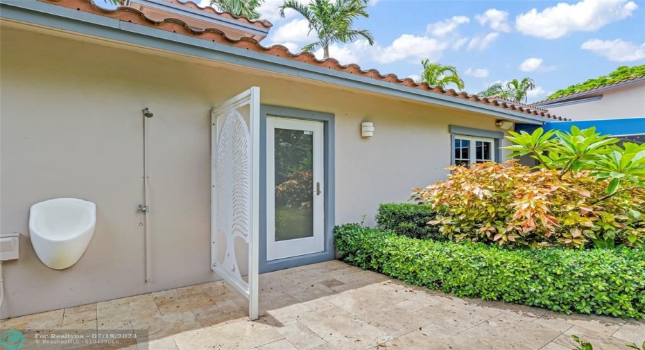 Outdoor shower and urinal near pool