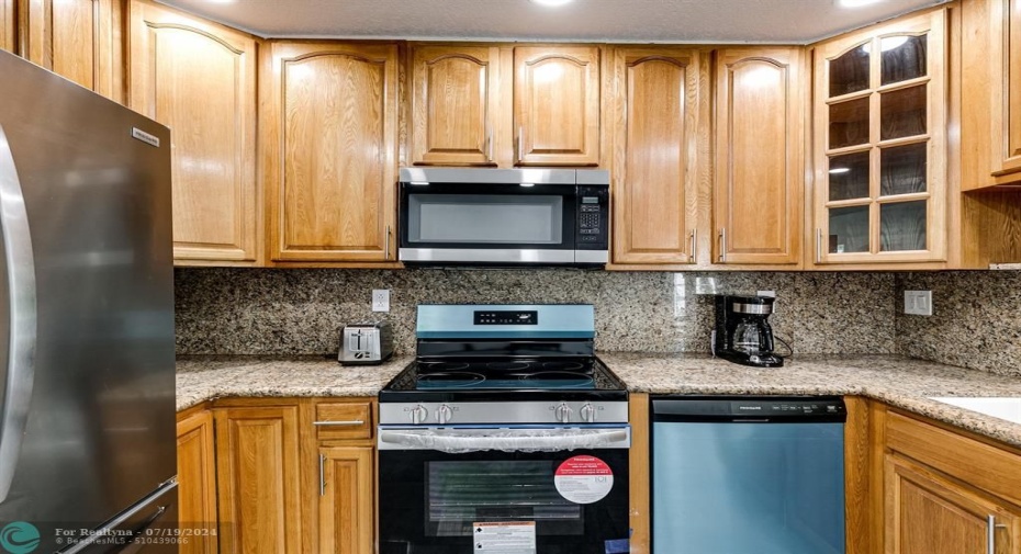Brand new appliances, wood cabinets and granite countertops.