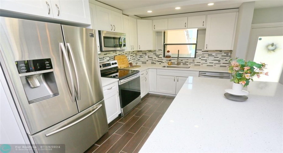 neutral kitchen with stainless steel appliances