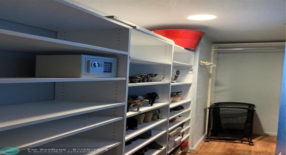 One side of walk-in closet