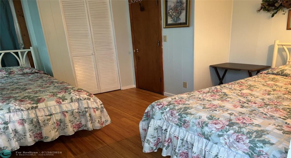 2nd Bedroom with twin beds. 1/2 bath located within the bedroom.