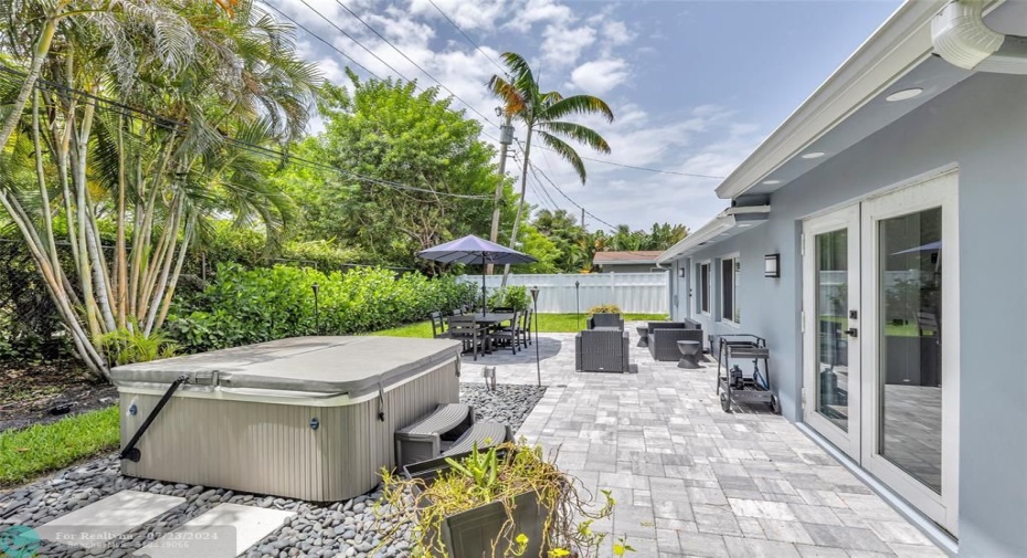 Enjoy leisure on your backyard surrounded by tropical trees and plants